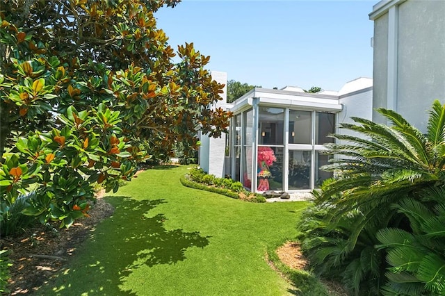 view of yard featuring a sunroom