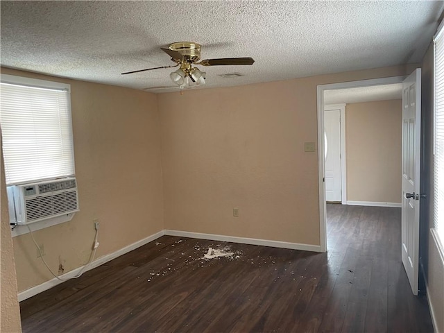 unfurnished room with dark hardwood / wood-style flooring, ceiling fan, and a textured ceiling