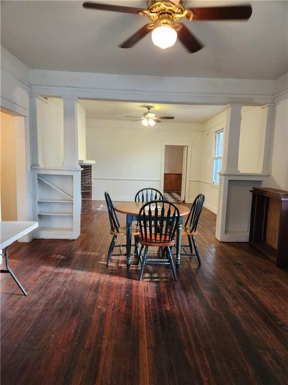 dining space featuring wood-type flooring and ceiling fan