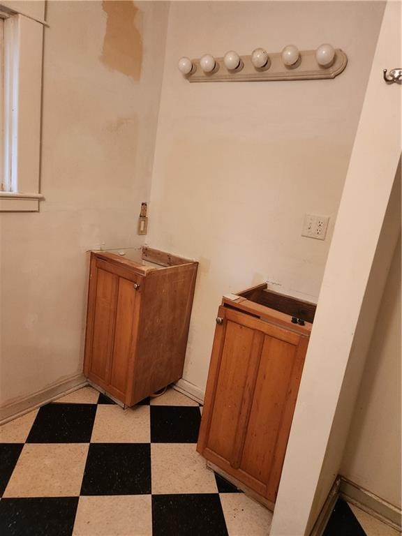 bathroom with tile patterned floors