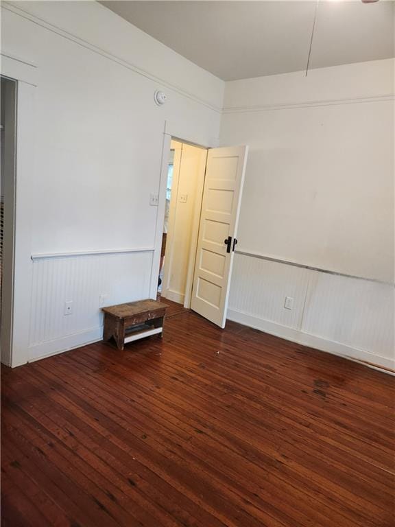 spare room with dark hardwood / wood-style floors