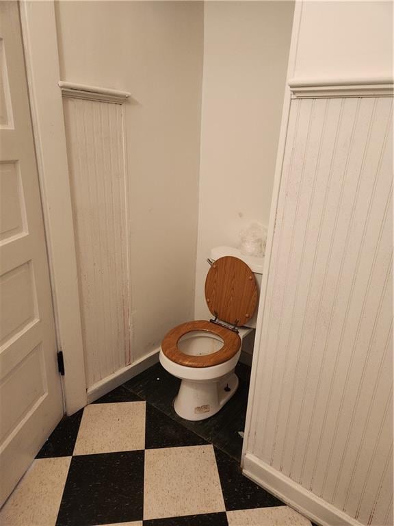 bathroom featuring toilet and tile patterned floors