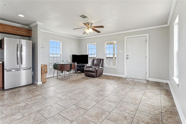 interior space with ornamental molding, ceiling fan, and light tile floors