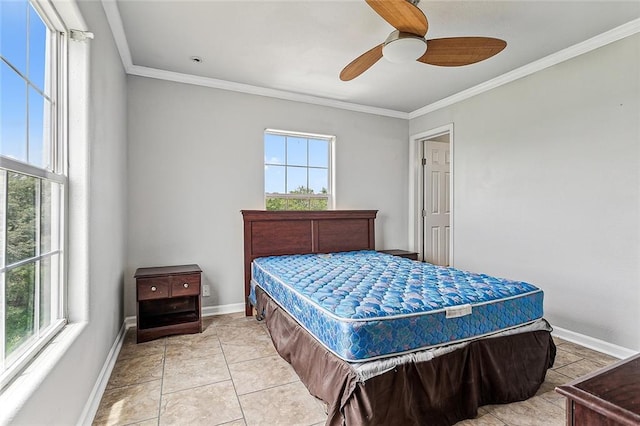 tiled bedroom featuring ceiling fan, multiple windows, and ornamental molding