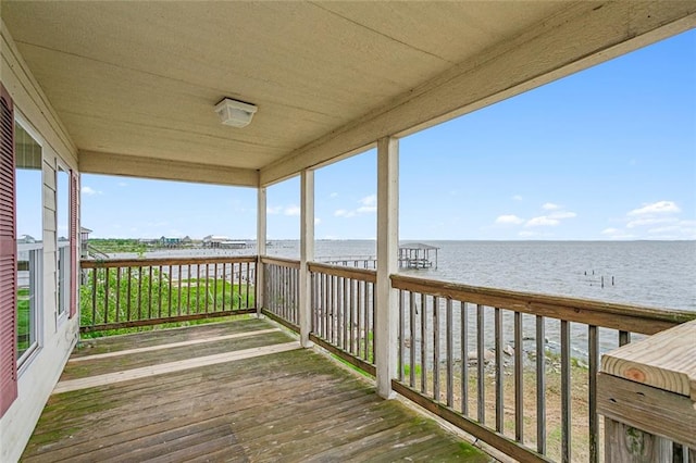 wooden terrace with a water view