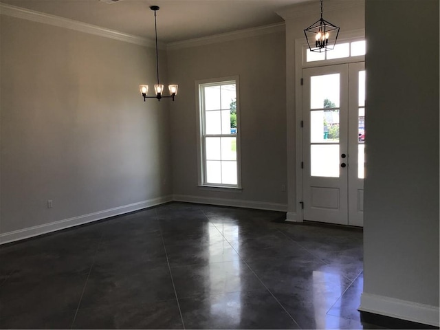 tiled foyer featuring crown molding and a chandelier