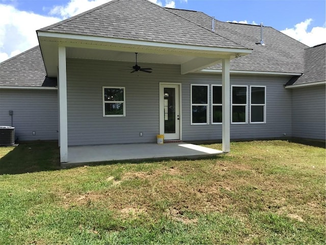 rear view of property with a lawn, ceiling fan, cooling unit, and a patio area