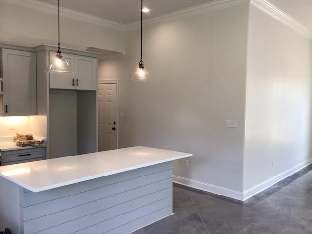 kitchen with gray cabinetry, hanging light fixtures, crown molding, and dark tile patterned floors