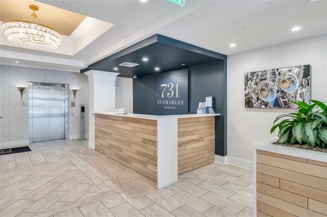 reception area with an inviting chandelier