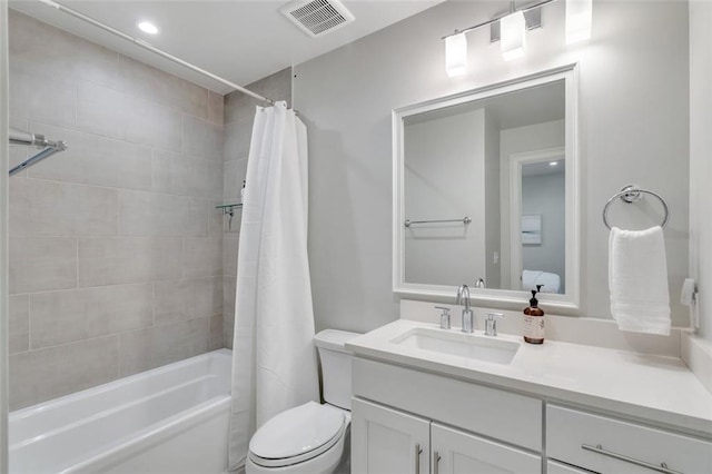 full bathroom featuring toilet, vanity, and shower / tub combo with curtain