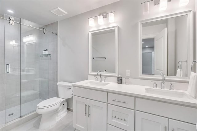 bathroom with vanity, toilet, and walk in shower