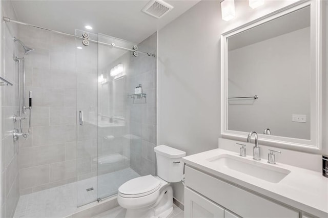 bathroom featuring walk in shower, vanity, and toilet