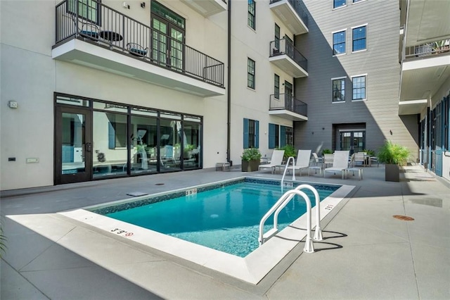 view of pool featuring a patio area