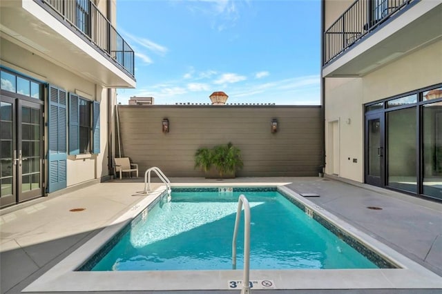 view of swimming pool featuring a patio area