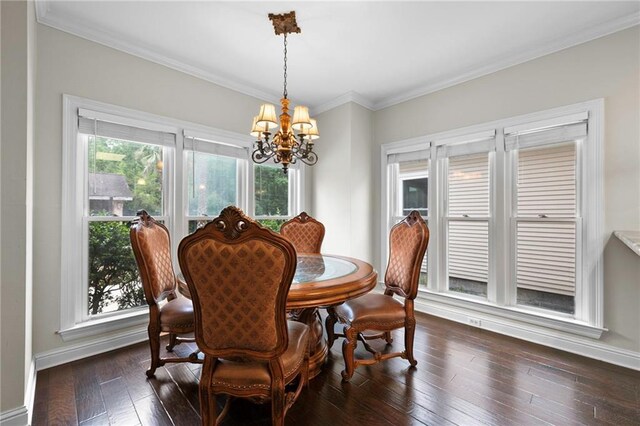 dining room featuring crown molding, dark hardwood / wood-style floors, plenty of natural light, and a chandelier