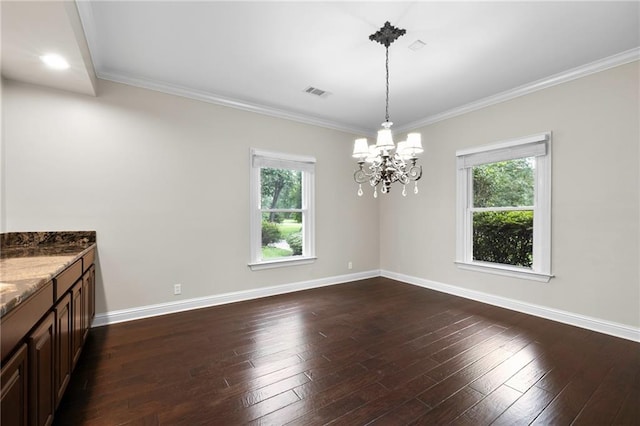 interior space with a chandelier, hardwood / wood-style flooring, and crown molding