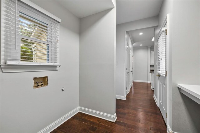 laundry room featuring dark hardwood / wood-style flooring and washer hookup