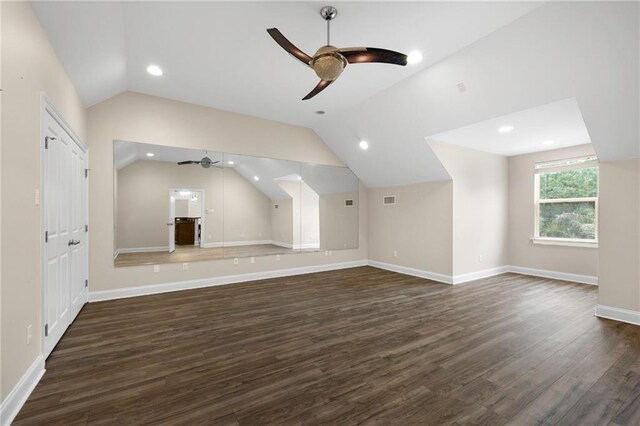 bonus room featuring dark hardwood / wood-style floors, ceiling fan, and lofted ceiling