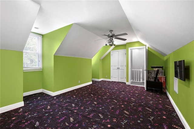 bonus room featuring ceiling fan, carpet floors, and vaulted ceiling