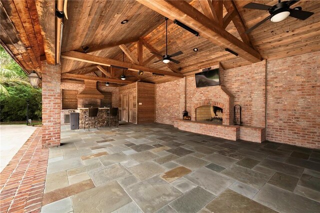 view of terrace with ceiling fan and area for grilling