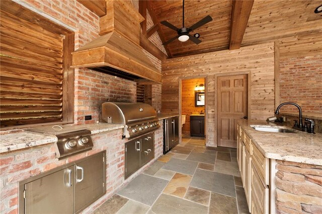 view of patio / terrace with ceiling fan, area for grilling, sink, and grilling area