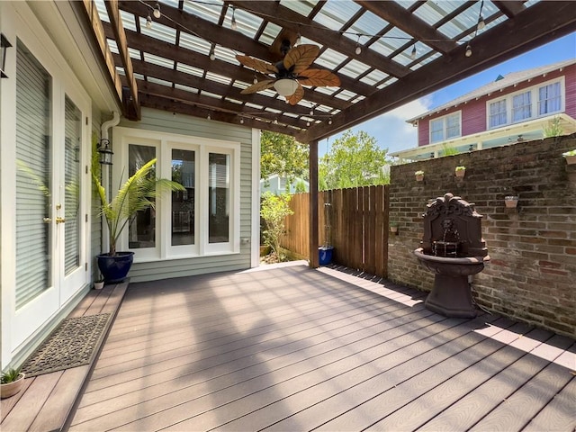 deck with ceiling fan and a pergola