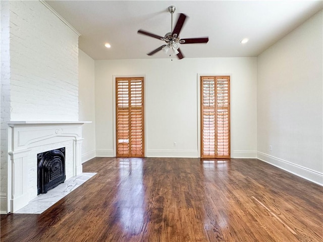 unfurnished living room featuring hardwood / wood-style flooring and ceiling fan