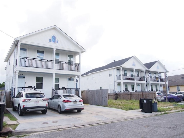 view of front of property with a balcony