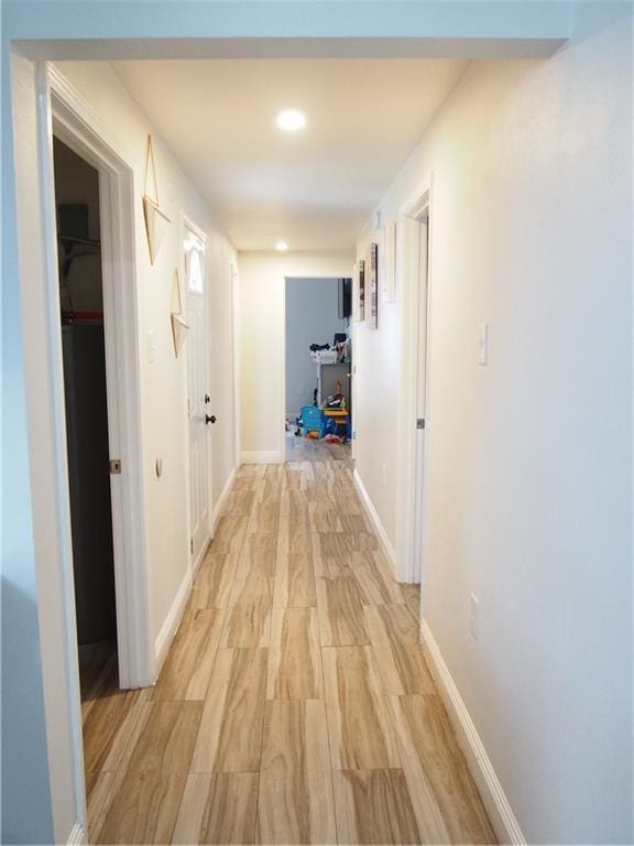 hall with light hardwood / wood-style flooring