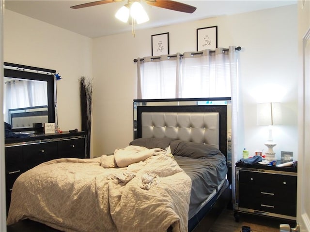 bedroom featuring ceiling fan and hardwood / wood-style floors