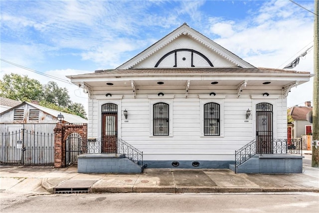 4102 Dauphine St, New Orleans, LA 70117 - shotgun-style home featuring fence