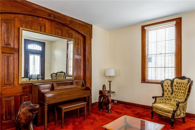 sitting room featuring plenty of natural light and carpet flooring