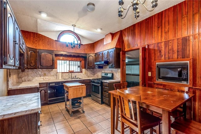 4102 Dauphine St, New Orleans, LA 70117 - kitchen featuring black appliances, a sink, decorative backsplash, light countertops, and lofted ceiling