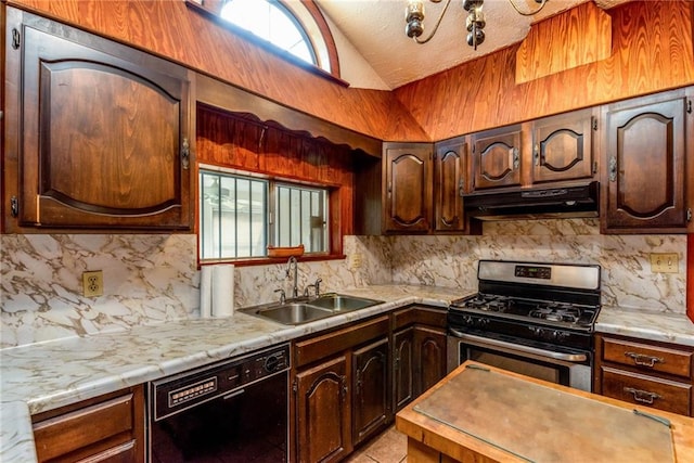4102 Dauphine St, New Orleans, LA 70117 - kitchen with under cabinet range hood, gas range, black dishwasher, a sink, and vaulted ceiling