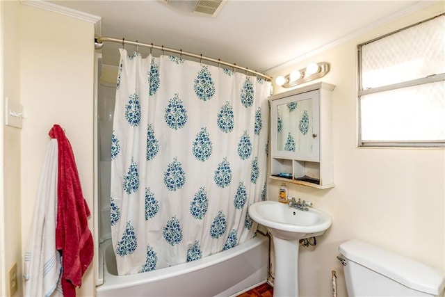 4102 Dauphine St, New Orleans, LA 70117 - bathroom with toilet and shower / tub combo with curtain