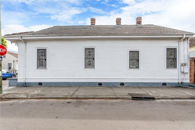 4102 Dauphine St, New Orleans, LA 70117 - view of property exterior featuring a chimney