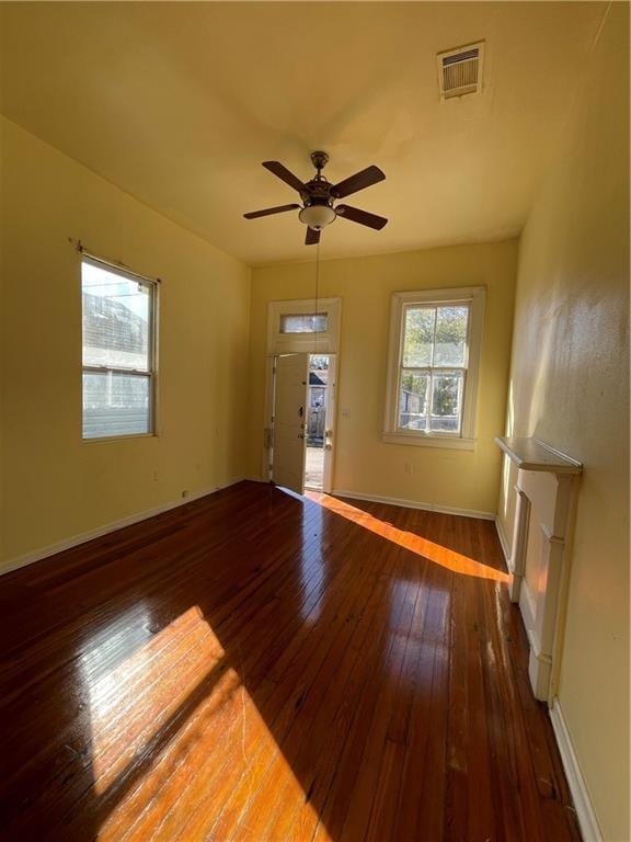 interior space featuring ceiling fan and dark wood-type flooring