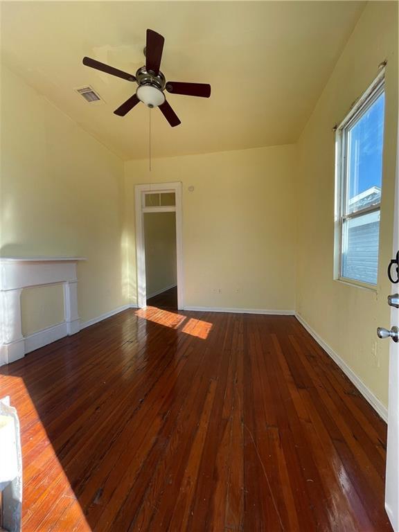 interior space featuring ceiling fan and dark hardwood / wood-style flooring