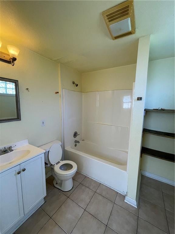 full bathroom featuring tile patterned flooring, vanity, toilet, and tub / shower combination