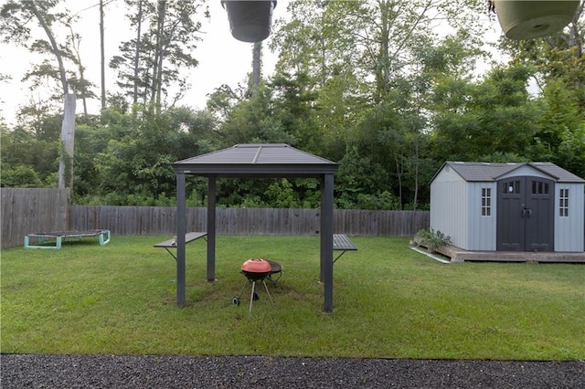 view of yard with a gazebo and a shed