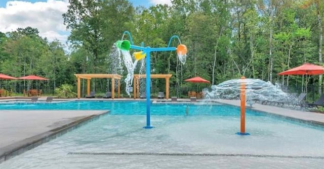 view of swimming pool featuring pool water feature