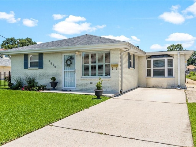 view of front facade with a patio area and a front lawn