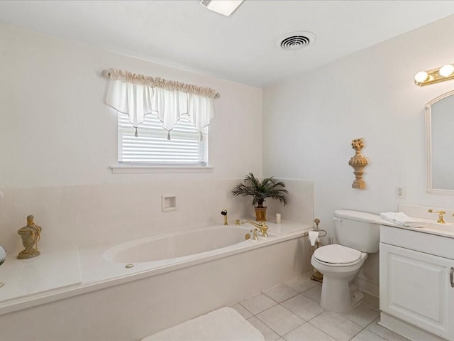 bathroom with toilet, vanity, tile patterned floors, and a washtub