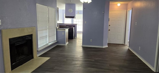 living room featuring dark hardwood / wood-style floors and ceiling fan