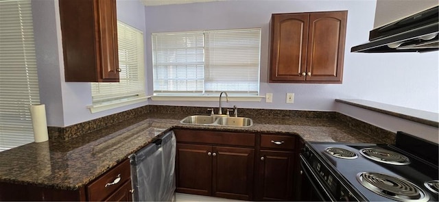 kitchen with dishwasher, dark stone counters, sink, electric range, and range hood