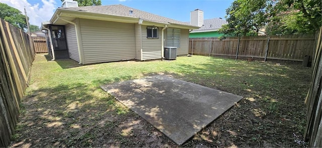 view of yard with a patio and central AC