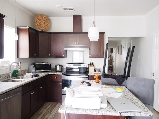 360406 3rd St, New Orleans, LA 70125 - kitchen featuring appliances with stainless steel finishes, under cabinet range hood, wood finished floors, a center island, and ornamental molding