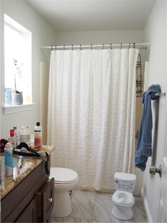 360406 3rd St, New Orleans, LA 70125 - bathroom with vanity, marble look tile flooring, and curtained shower