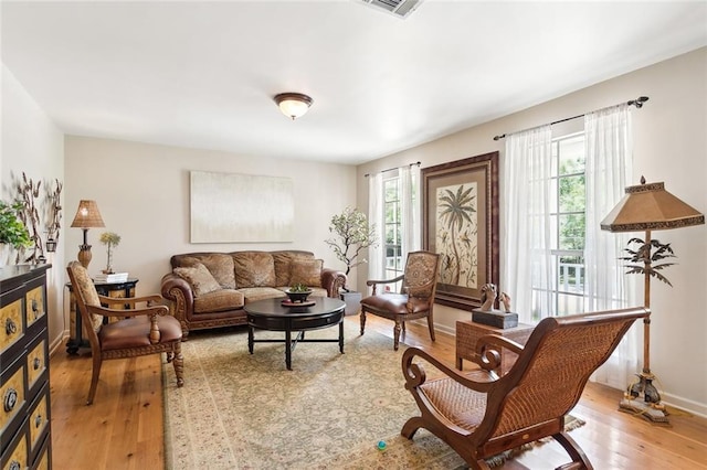 sitting room featuring light hardwood / wood-style floors