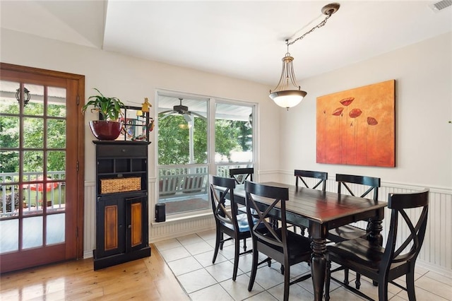 dining space with light hardwood / wood-style floors and plenty of natural light